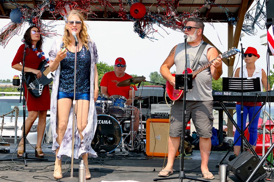 Local Musicians from the groups Dolled Up and Witness Protection perform at the Fourth of July celebrations in Point Roberts.