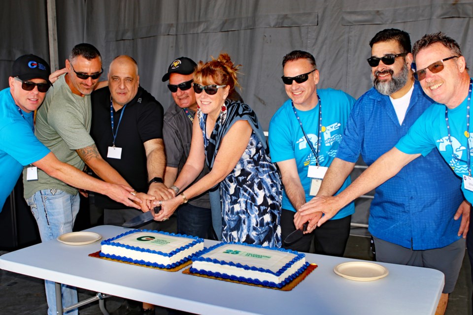 Global Container Terminals celebrated 25 years in Delta with a community open house on Saturday, June 25. Pictured left to right; Daniel Howell, vice-president of operations for GCT; Tsawwassen First Nation Coun. Steven Stark; Tony Sorace and Frank Scigliano representing ILWU514, TFN Coun. Valerie Cross; Eric Waltz, president of GCT Canada; Hermen Kailley from ILWU502 and Mike McLellan from GCT Canada cut a pair of cakes to mark the opening of the anniversary celebration.