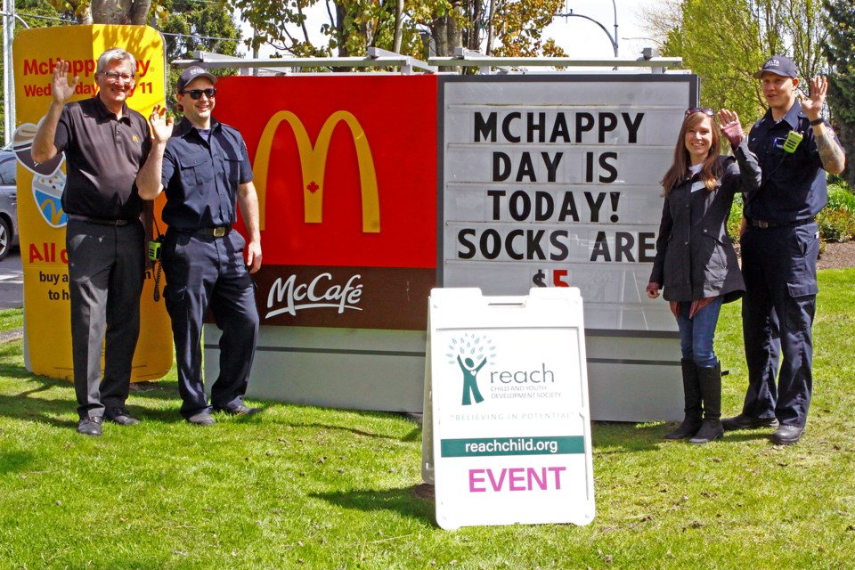 Pictured left to right; McDonald's owner Steve Krawchuck, Delta firefighter Tanner Gunn, Kristen Bibbs from Reach and Delta firefighter Kevin McNabb welcome guests to McHappy Day in Ladner.