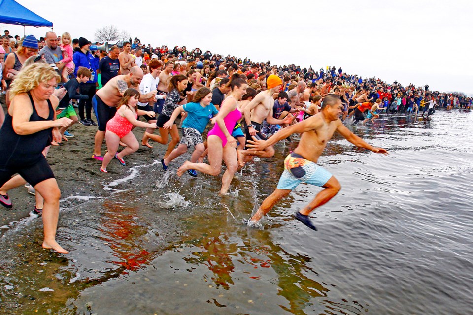 An estimated 450 people braved the cold waters of Boundary Bay on Sunday afternoon Jan. 1 as the City of Delta hosted its annual Polar Bear Swim, which was held for the first time in two years due to the COVID-19 pandemic restrictions. Prizes and awards were handed out to Harlan Theaker, Luke Logan and Bobby Yagin as the top three swimmers who reached the bell first after the swim. George Brazier received a prize at the oldest swimmer while Sheree Stevens, who was visiting from Australia, received a prize for the participant who took part from the furthest away from Delta.