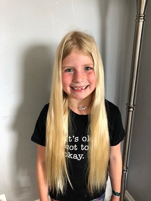 Delta BC girl cutting her hair for Wigs for Kids charity - Delta Optimist