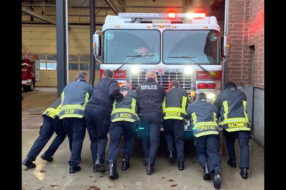 They celebrated an old tradition at Fire Hall No. 3 in North Delta, dating back to the fire department days of horse-drawn equipment when members had to push equipment back into a bay.