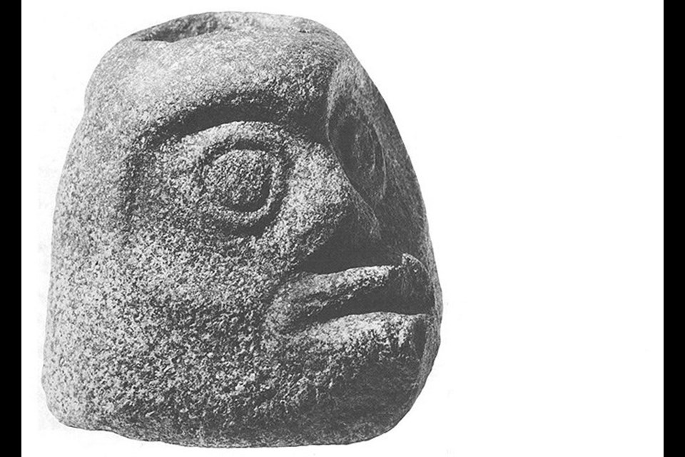 A head mortar laboriously sculptured from tough red granite was unearthed in Beach Grove.
