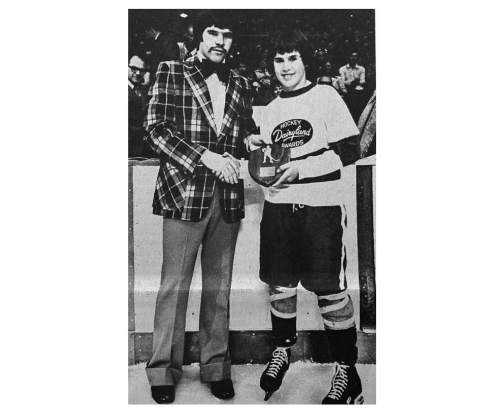 vancouver-canucks-dennis-kearns-presents-an-award-to-north-delta-hockey-player-in-1974