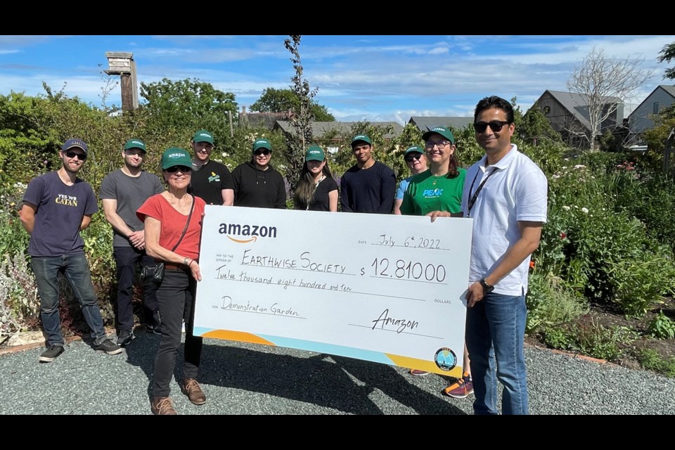 Amazon YVR4 associates presents donation to the Earthwise Society.