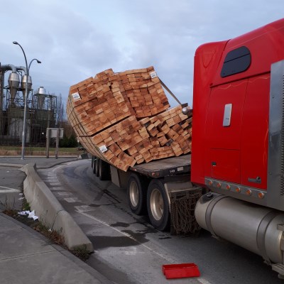 A semi-truck was pulling a trailer loaded with lumber. The load was not secured adequately which officers believe resulted in the cargo almost falling off the trailer. This incident occurred in Tilbury.