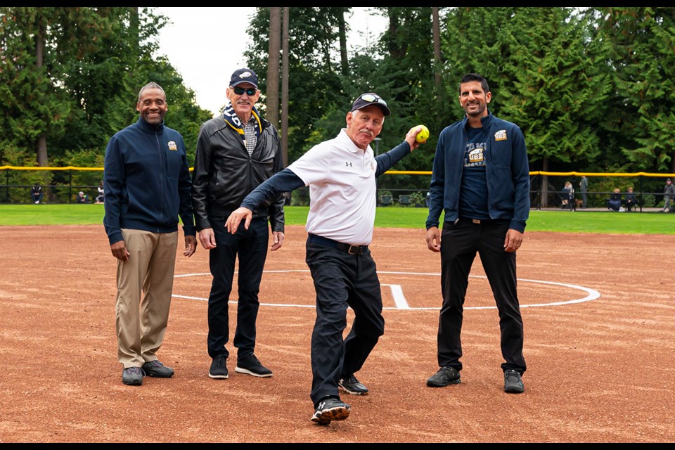 UBC softball coach and Tsawwassen resident Gord Collings delivers the ceremonial first pitch as the field named in his honour officially opened on Oct. 2.