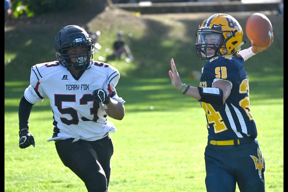 South Delta Sun Devils quarterback Dominic Dumas looks down field during his team's 8-7 win over the Terry Fox Ravens last week. It was the first competitive high school game in Delta in 18 months. 