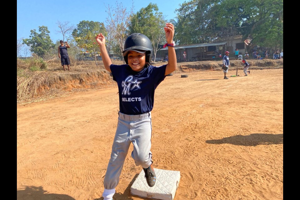 Wearing a donated uniforms, Mexican children run the bases on a makeshift field during last year's camp in Puerto Escondido  run by volunteer coaches from Ladner and Tsawwassen.