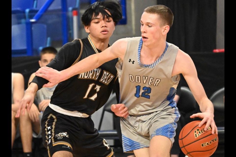 North Delta's Allen Lomboy tries to slow down Dover Bay star Luke Linder during Friday's semi-final encounter at the B.C. Boys AAA Basketball Championships at the Langley Events Centre. Linder scored 42 points to lead Dover Bay past the Huskies. 
