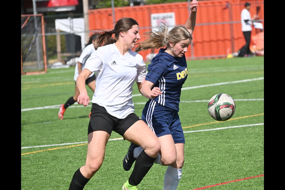 South Delta's Grace Grannary battles with a McMath opponent during Monday's 4-2 semi-final win over McMath in the South Fraser AAA playoffs. The Sun Devils went on to capture the inaugural zone playoff.