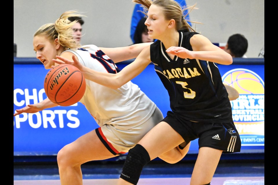 Seaquam's Callie Brost knocks the ball away from Yale's Samara Mason during Thursday night's quarer-final game at the BC AAAA Girls Basketball Championships in Langley.