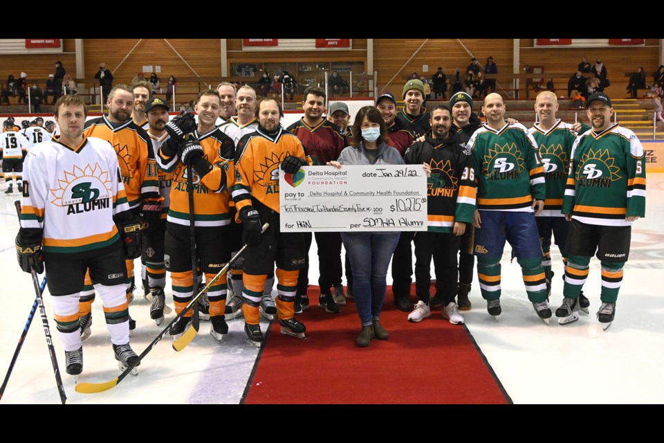 Delta Hospital and Community Health Foundation's Annual Giving Manager Shari Barr was presented a cheque well north of $10,000 by organizers of Saturday's inaugural South Delta Minor Hockey Alumni Event at the Ladner Leisure Centre. 