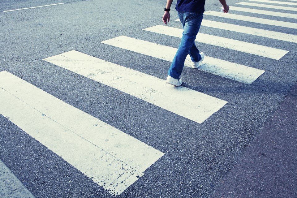 man-walking-in-a-crosswalk