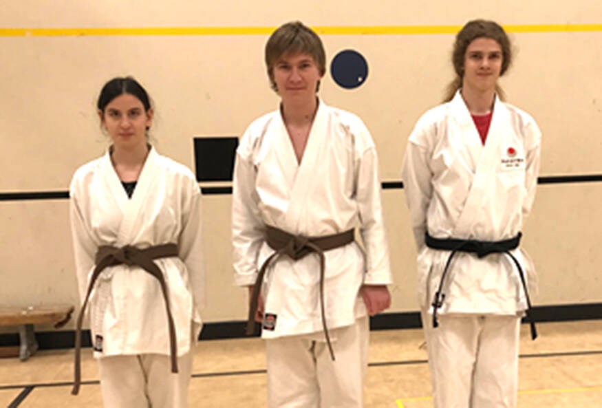 Tsawwassen Shotokan Karate students (left right) Maya Sirton (15), Brennan Dyck (14) and Parker Teal (16) recently went through successful grading to earn their brown belts and black belt respectively. Submitted Photo
