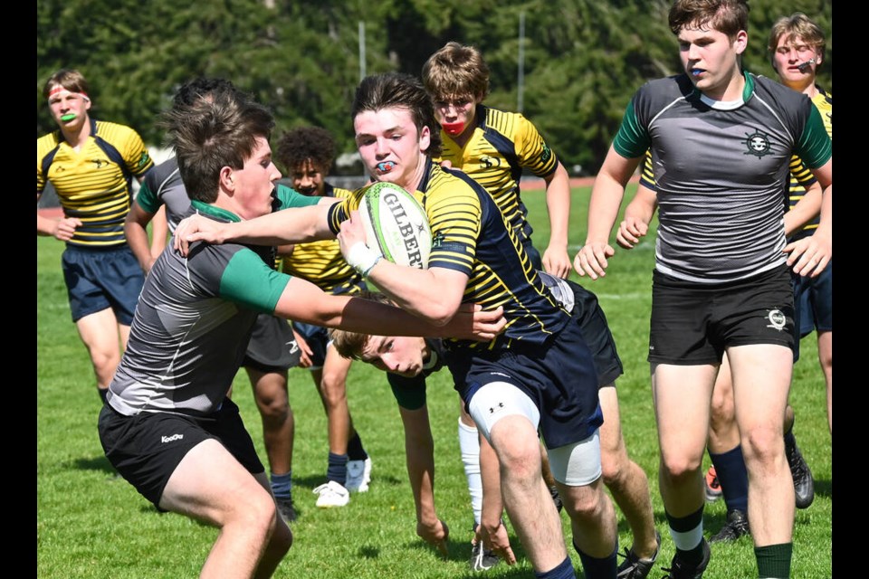 South Delta Sun Devils' Nate Young is on his way for one of his team's tries in last week's win over Earl Marriott in South Fraser Junior Boys Rugby League action. Mark Booth Photo