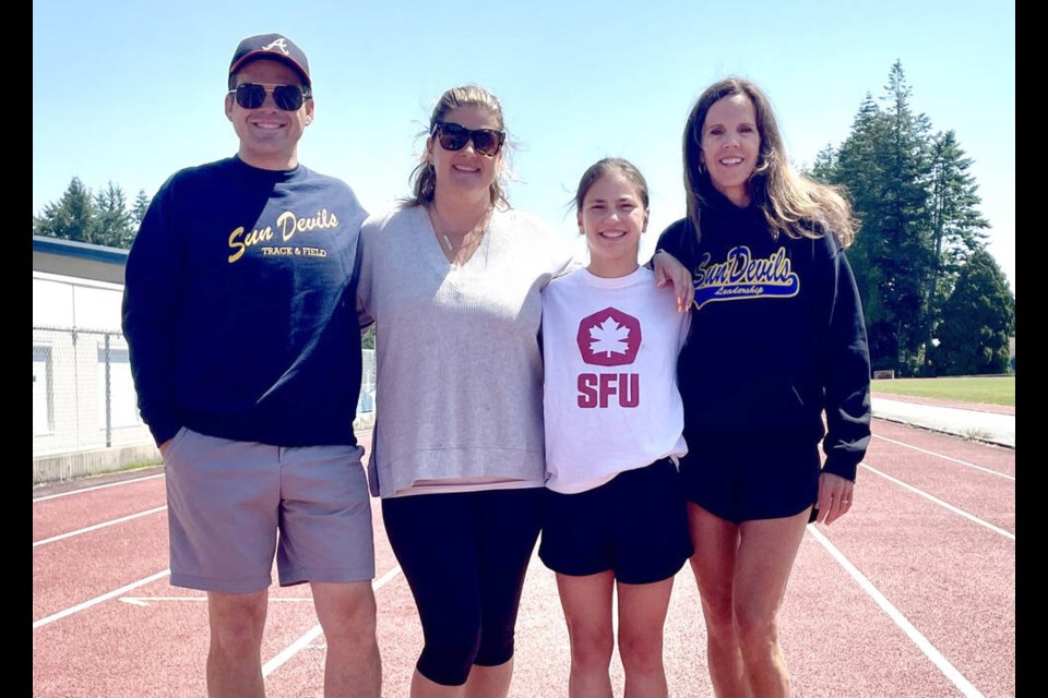 SFU bound Gemma Dumas with her track and cross-country coaches throughout her five-year high school career at South Delta (left to right) Gatlin Saip, Brooke Jacobs and Carol Lingham. Mark Booth Photo