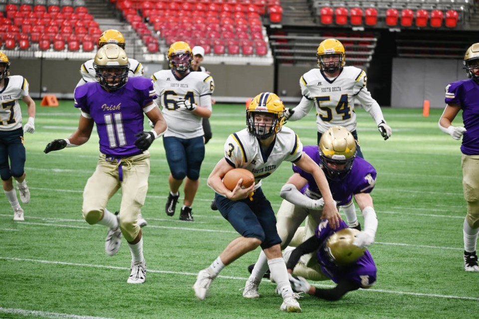 Sun Devils quarterback Damian Dumas scrambles for a first down in action Saturday in the JV AAA football championship against Vancouver College at BC Place. Ian Jacques Photo 