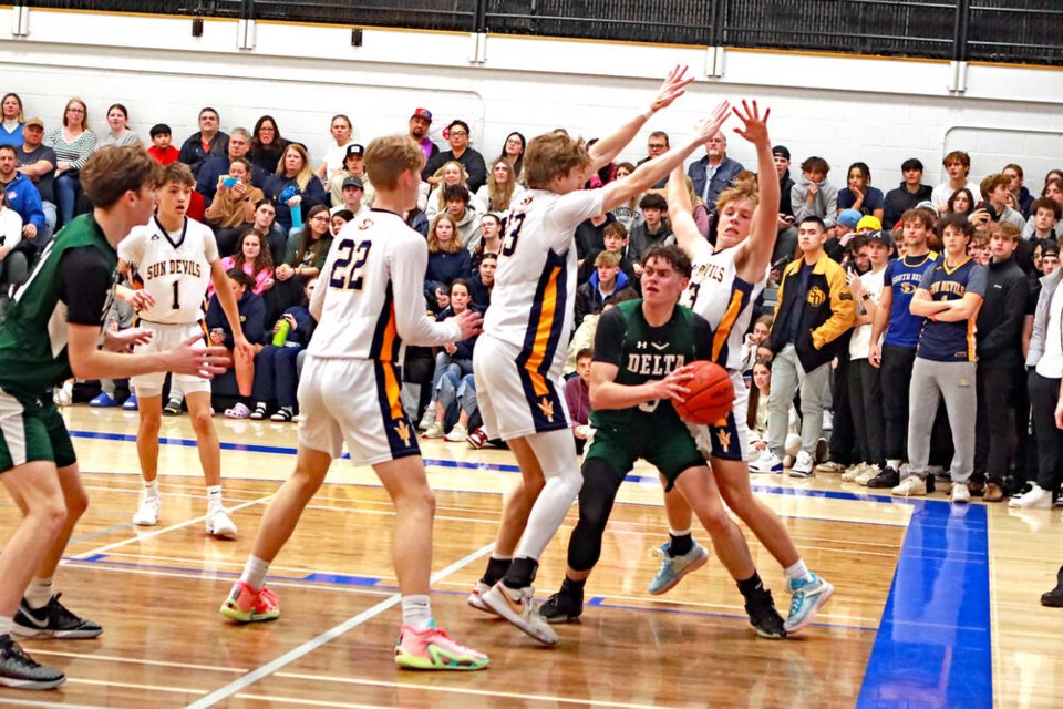 The SDSS senior boys beat the DSS senior boys 81-69 in front of a packed gym at South Delta Secondary Monday night. Jim Kinnear Photo 