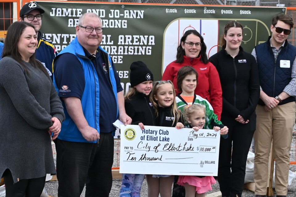 Amanda McKay, president of minor hockey, Shawn Heard, and young Elliot Lakers with a cheque for $10,000. May 1, 2024