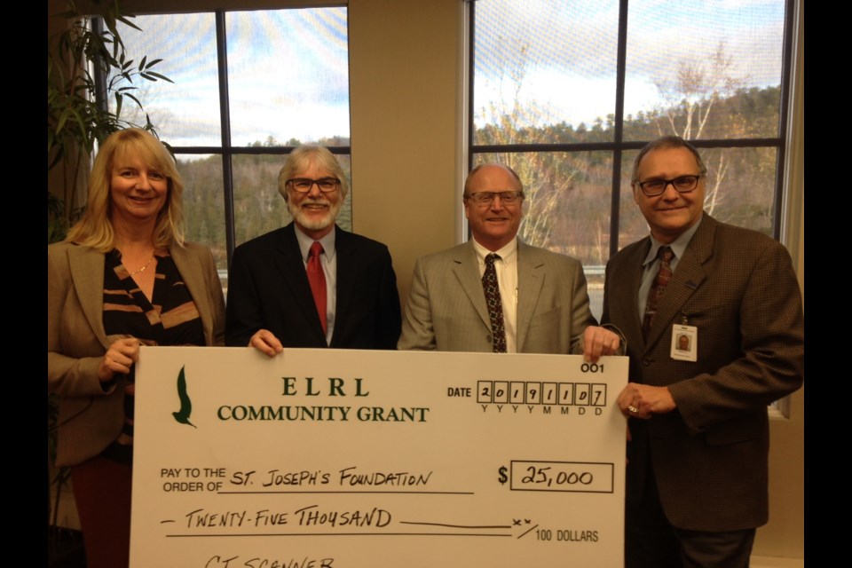 Elliot Lake Retirement Living donated $25,000 toward the planned $1.6 million CT Scanner for St. Joseph’s General Hospital. Making the donation, from left, was Retirement Living GM Rhona Guertin and chairman Gil Contant to Hospital Foundation chairman William Elliott and hospital CEO Pierre Ozolins. Photo by Kris Svela for ElliotLakeToday