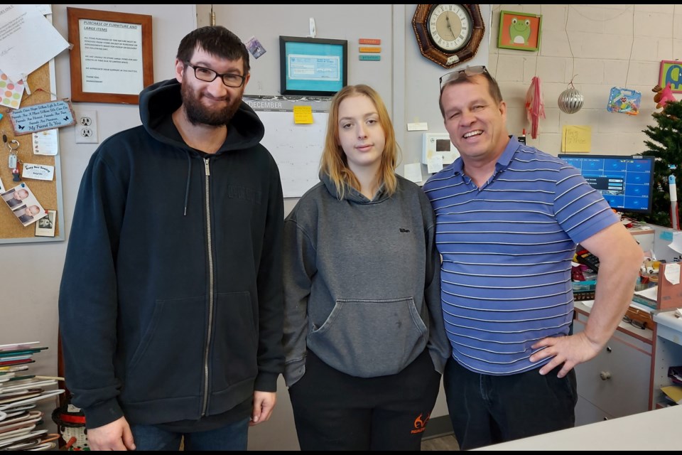 Three of the many volunteers at the Society of St. Vincent de Paul Thrift Store. From left to right, are Nick Shaw, who has been with them for about three years; Ashley Dean-Bonfig, who has been there six months; and David McEwen, president of the society and a volunteer for 15 years.