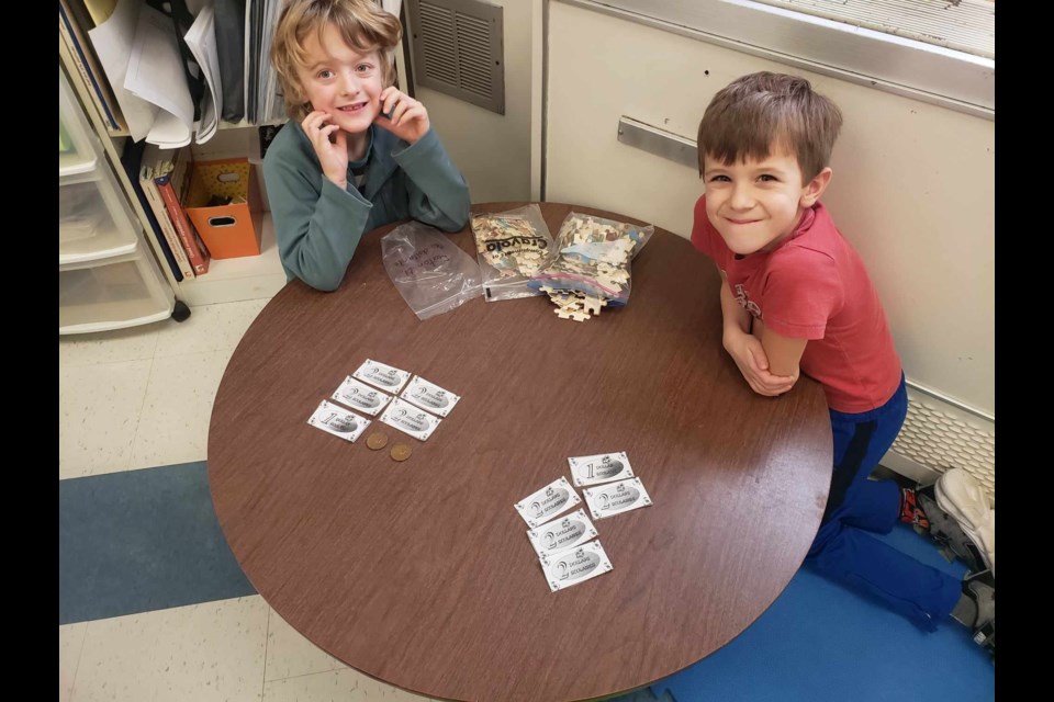 Grade 2 students are exploring financial literacy through hands-on exercises. 