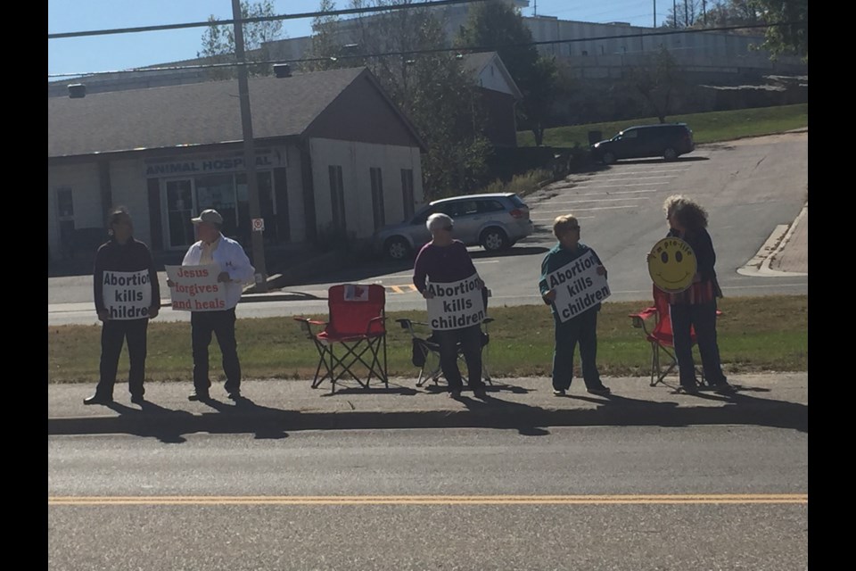 Pro life protesters marched for the Life Chain event on highway 108. Melanie Farenzena/ElliotLakeToday