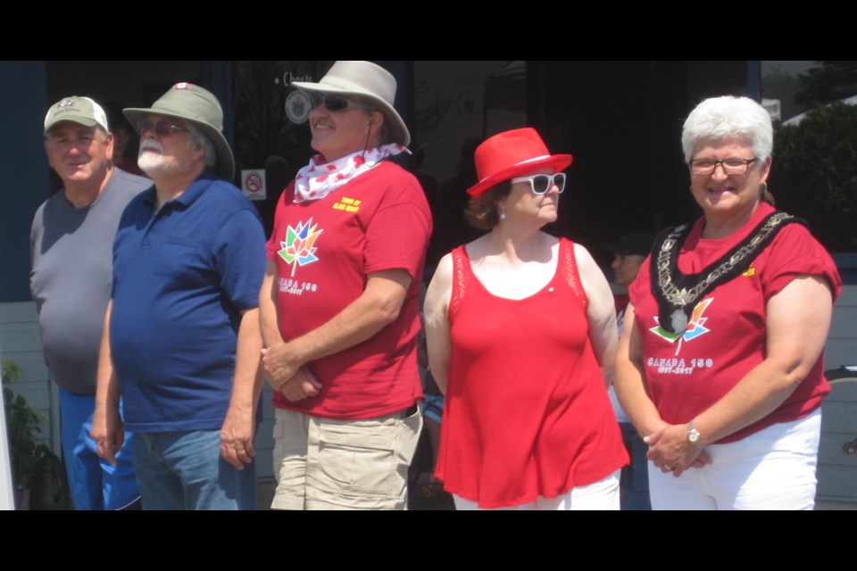 Mayor Sue Jensen, right,  and members of her council joined in the official opening of the town’s Canada Day events. Photo by Kris Svela