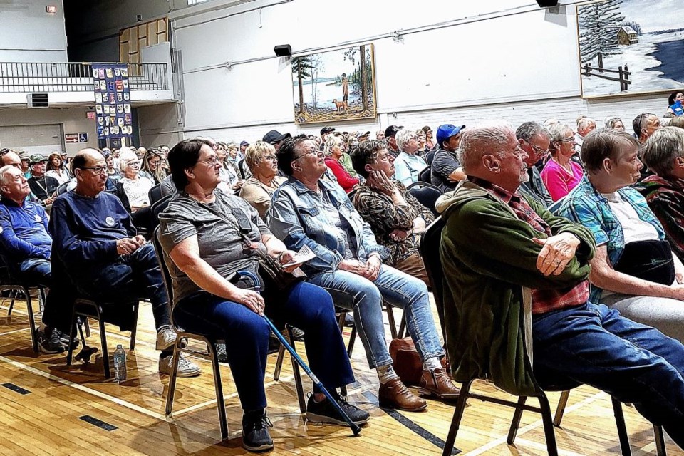 Interested people listen to candidates speak at the Elliot Lake Rotary Club all candidates meeting on Tuesday evening.