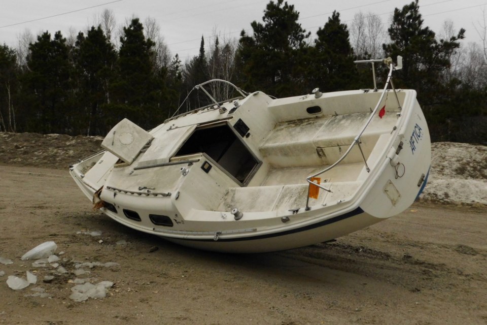 The fate of a derelict sailboat discovered in the parking lot of the Dunlop Lake boat launch in April remains unknown.