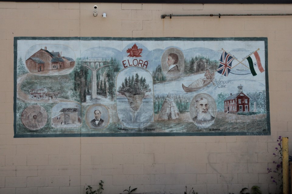 This mural depicting Elora's history and places was painted in 1982 on what was Little Katy's Shoppette.
