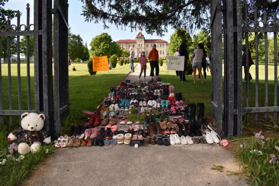 Observers came by to add shoes and to pay respect. Keegan Kozolanka/EloraFergusToday
