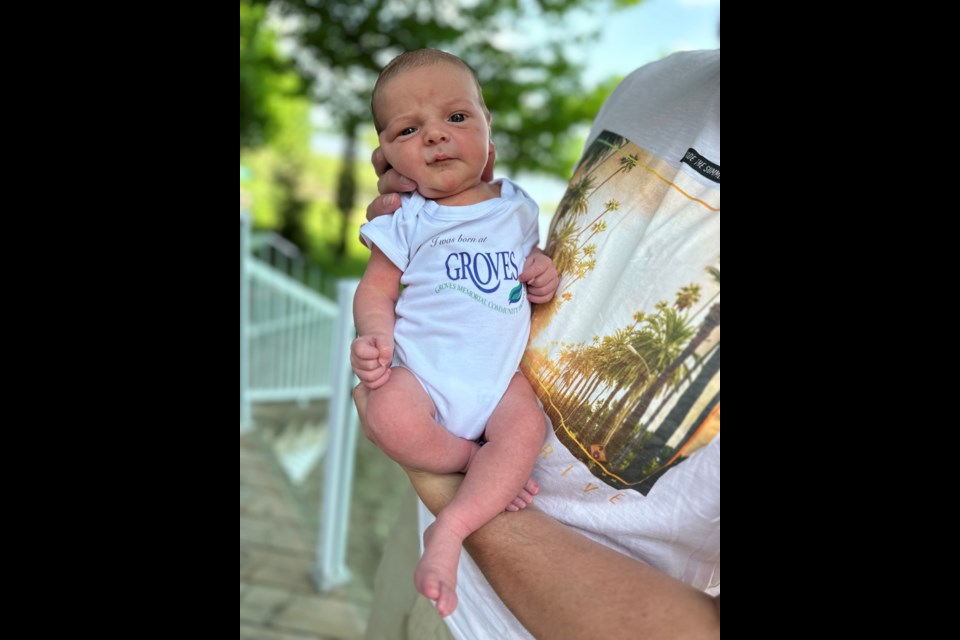 The inaugural Groves Baby onesie was presented to Rowe Family friends, Tye and Masha McGinn, upon the birth of their son, Wyatt.