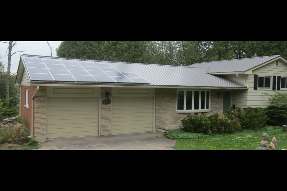 Erin Citizens' Climate Lobby member Ron Moore has significantly reduced his carbon footprint through measures at his home like installing solar panels on his roof.