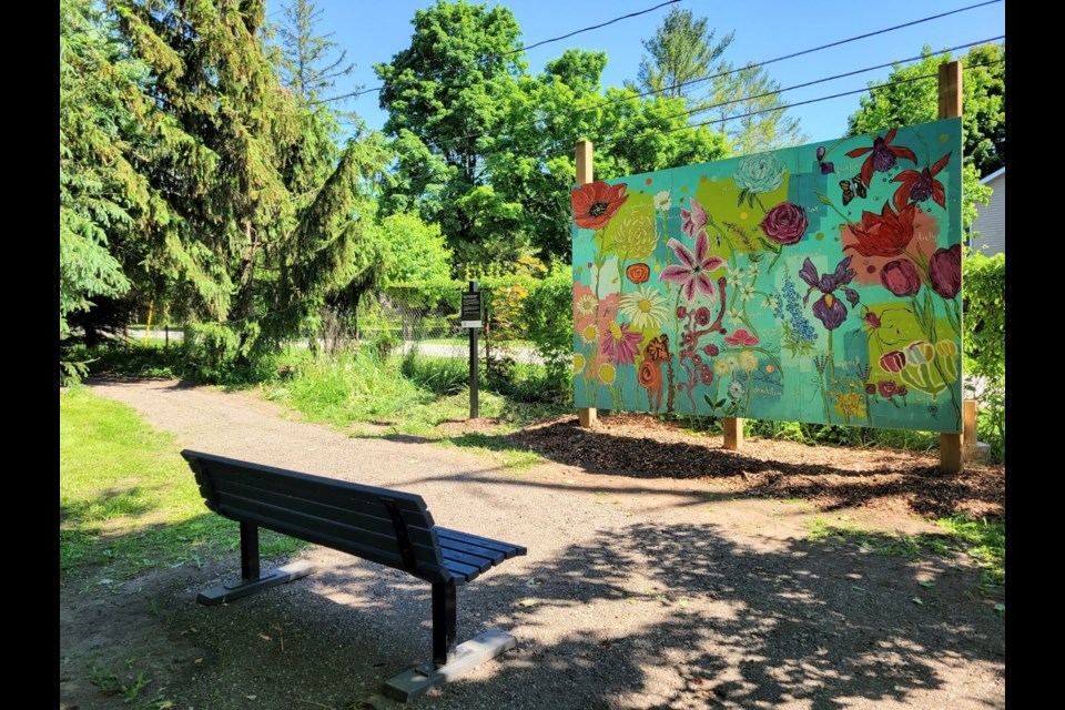 This mural titled 'Connecting Generations' was created together by seniors and youth.