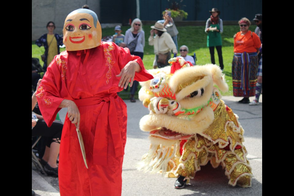 Performers got to witness a southern Chinese Fut Shan Lion dance, where a lion's movements are mimicked in costume, at the Wellington County Multicultural Festival.
