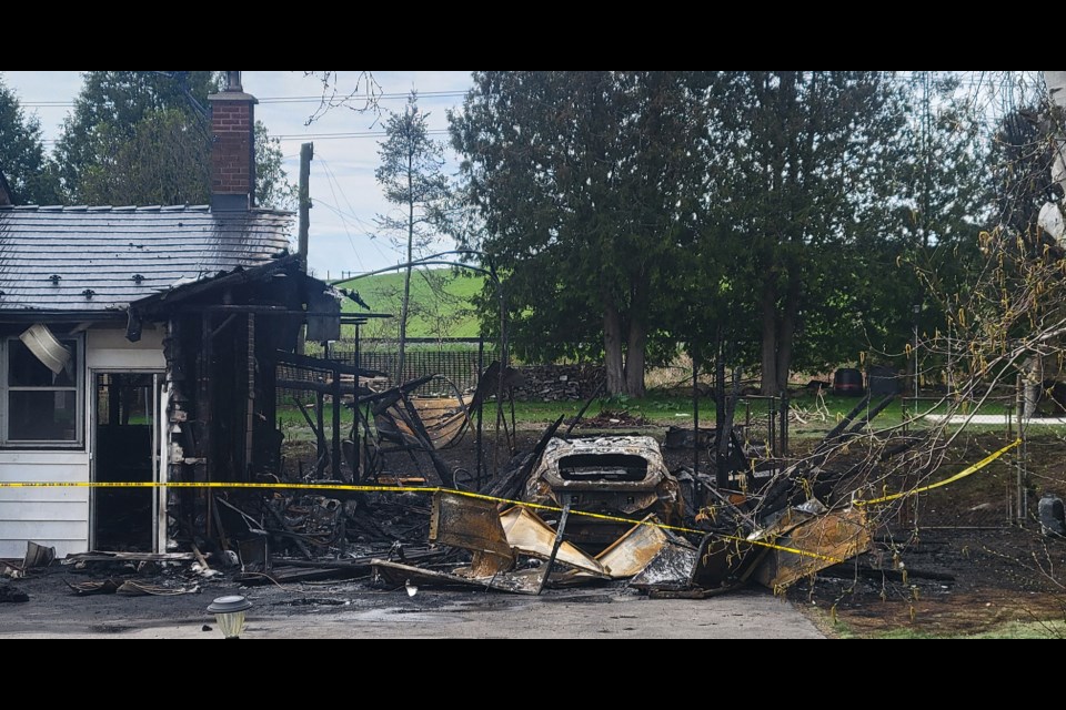 A garage was destroyed in a house fire on Highway 7.