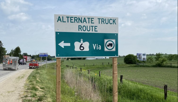 Signage directs truck traffic to take an alternate route along Wellington Road 7 away from downtown Fergus. Twitter photo.