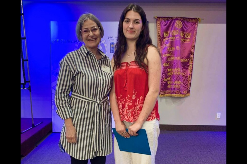 Avaline Booth, right, with a member of the Rotary Club of Guelph after accepting the Indigenous Youth Award.