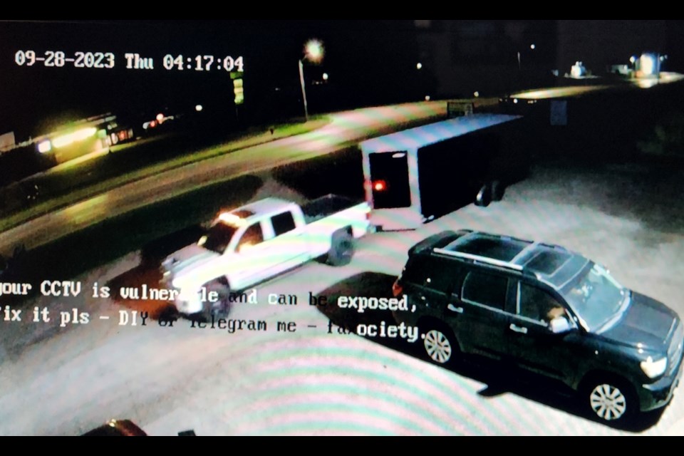 A white pickup truck was used to steal a black Freedom 822 enclosed trailer from an Arthur business on September 28