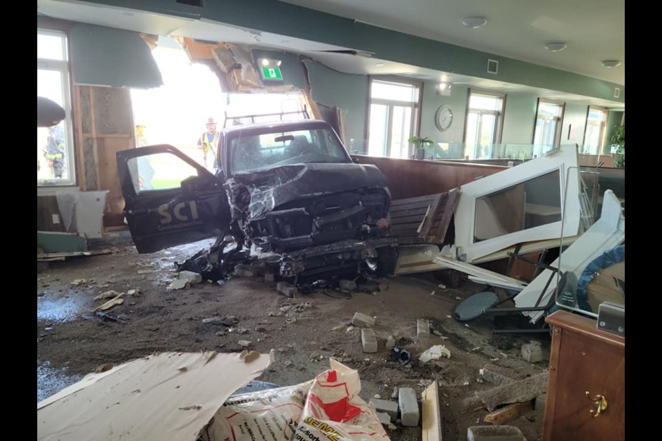 A pickup truck crashed through a building in Mapleton on Wednesday morning.