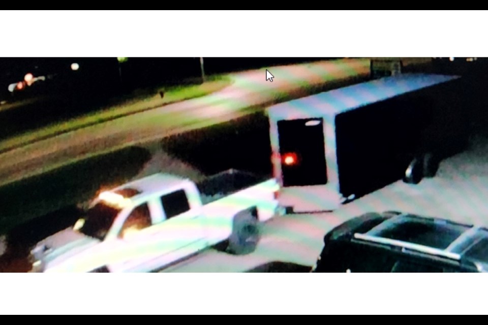 The suspect vehicle is described as a white, Chevrolet pickup truck, with no front or rear license plates, extended side mirrors, dark tinted windows, lifted suspension and oversized tires