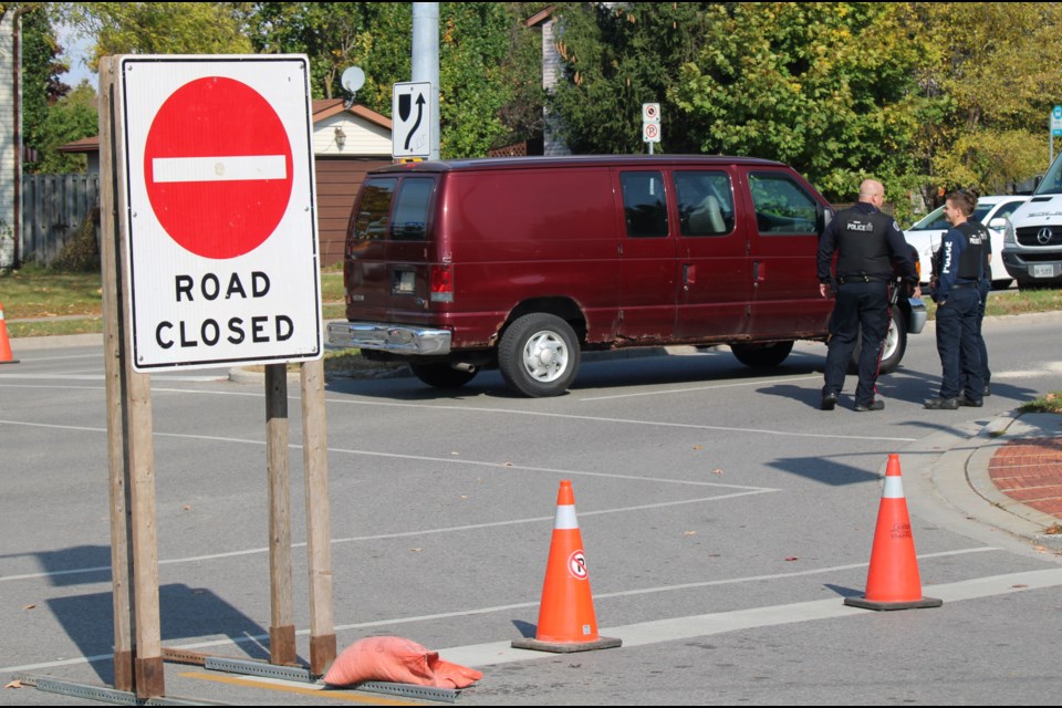Police continue their investigation at the intersection of Rickson Ridge and Kortright Road Tuesday morning.