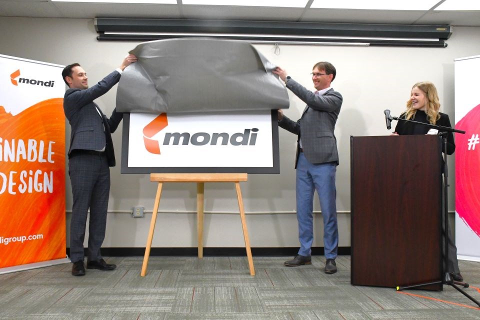 Matt Jones, Alberta’s minister of Jobs, Economy and Trade (left), and Roman Senecky, Mondi's chief operating officer for Kraft Paper, unveil the Mondi logo during a press conference at the Hinton Pulp mill on Wednesday, March 20, 2024. | Peter Shokeir / Jasper Fitzhugh