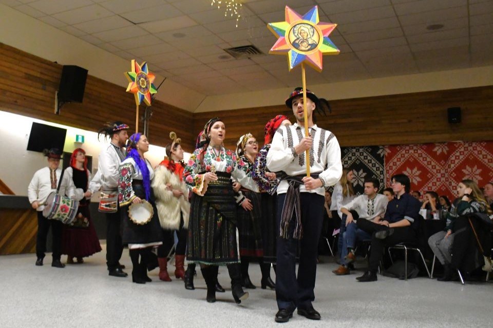 The Ruta Musical Folk Ensemble marches out for their performance during Mountain Malanka at the Jasper Activity Centre on Jan. 20, 2024. This was a fundraising event for UFest Edmonton Ukrainian Festival, the largest multi-day Ukrainian festival in Western Canada. | Peter Shokeir / Jasper Fitzhugh