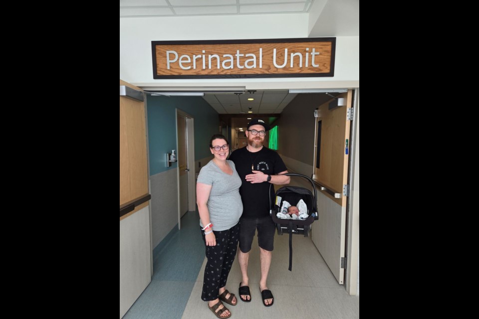 Meg Markulin and Terry Chauncey with their newborn baby Atticus Wren Chauncey at the hospital in Kelowna, B.C.