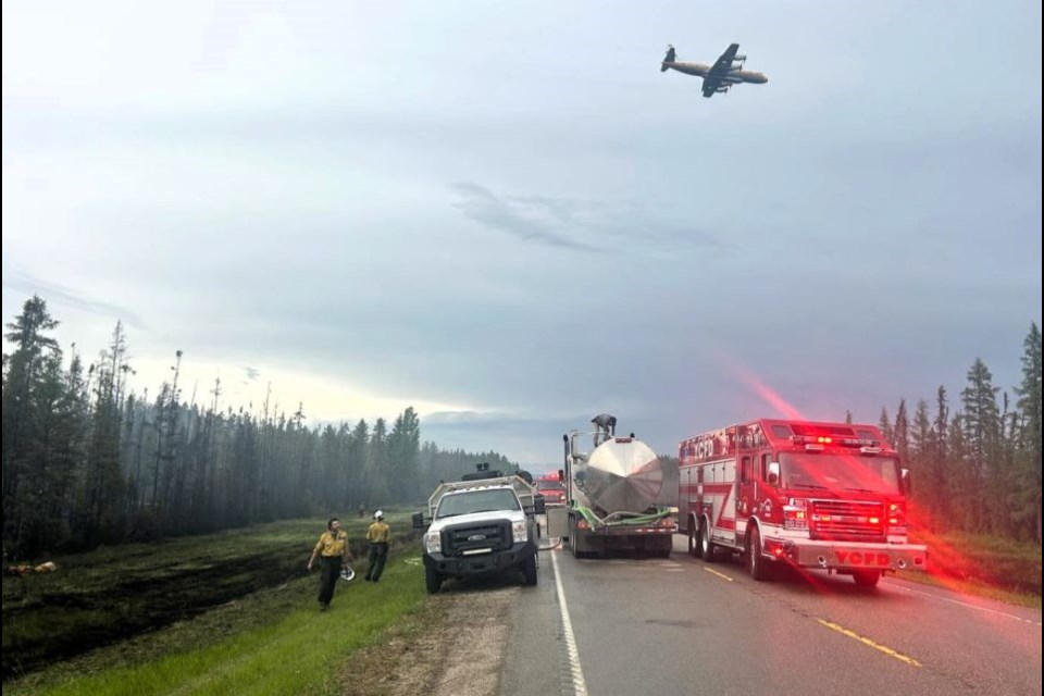 Alberta Wildfire and the Yellowhead County Fire Department respond to a wildfire near Peers, Alta. on Thursday, May 29, 2025.