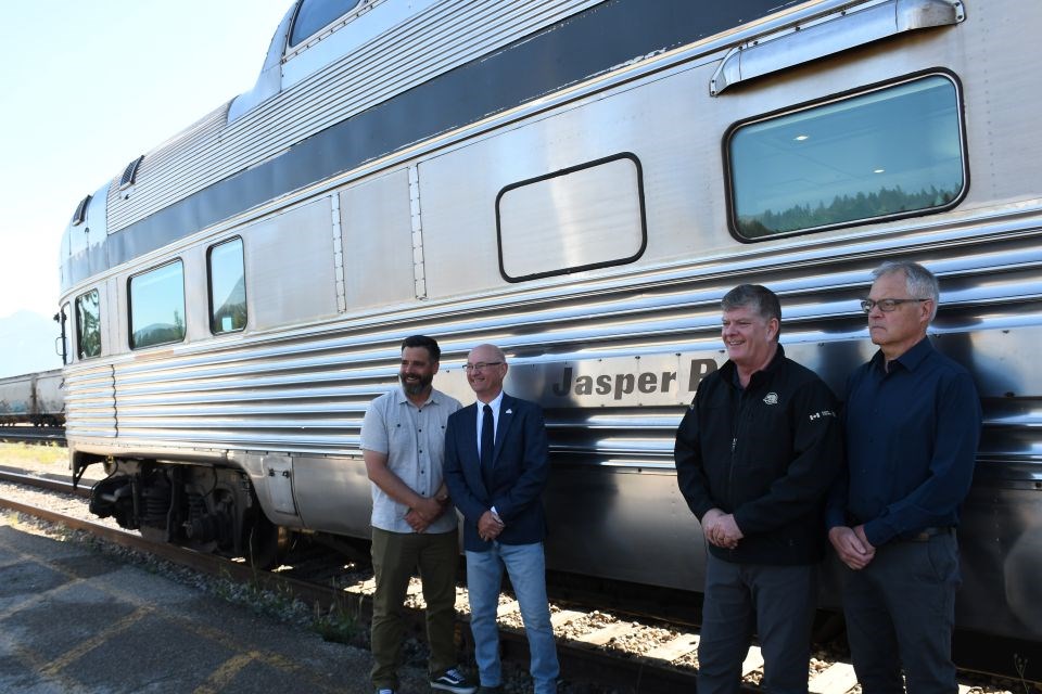 Local officials celebrate the naming of a Via Rail car after Jasper National Park during a ceremony at the Jasper Train Station in Jasper, Alta. on Wednesday, July 2, 2025.