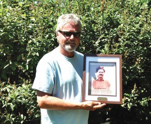 Kees Huibers with the commemorative plaque he received after his induction into the Campbellton Sports Hall of Fame. Sarah Makowsky photo